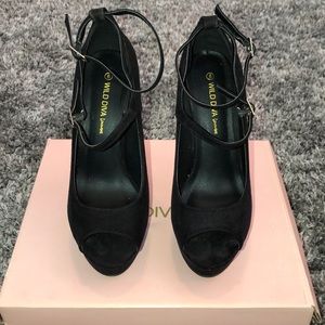 Women’s black strap heels.